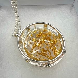 NWOT silver tone necklace with gold flake pendant